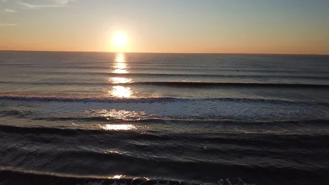 Sunset over the ocean w/ various colors on the horizon Stock Footage 95162739