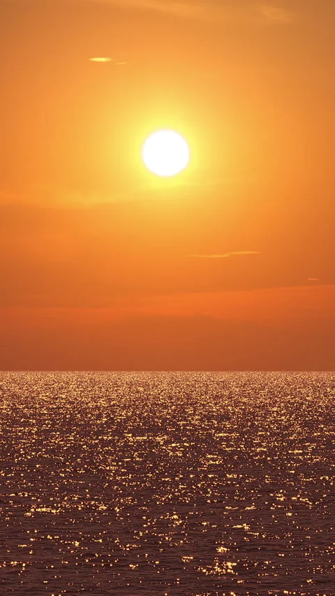 Sunset over Ocean Water Waves with Sparkling Golden Reflections Vertical View Video stock 346145980