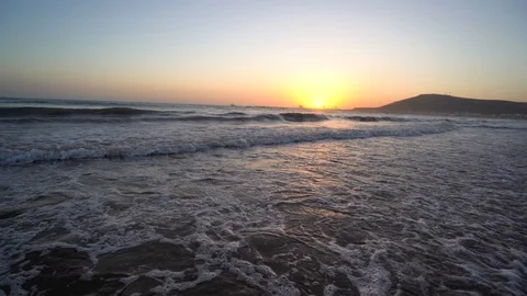 Sunset over the ocean. Waves and blue water Stock Footage 120328396