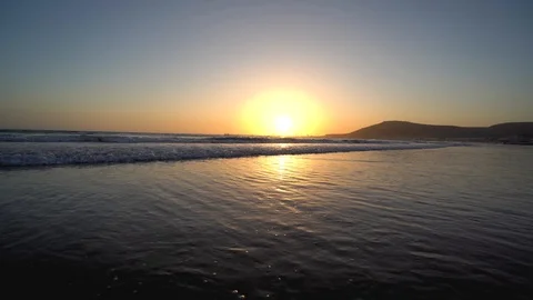 Sunset over the ocean. Waves and blue water Stock Footage 120328398