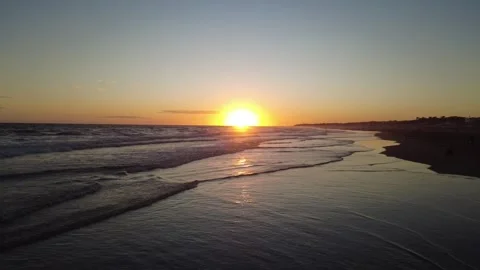 Sunset Over Ocean Waves and Beach Shoreline Argentina Stock Footage 314408437
