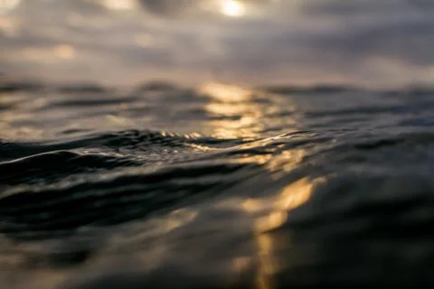 Sunset over ocean waves with copy space Stock Photos