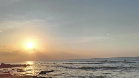 Sunset over Ocean Waves with Golden Sunlight on Beach Stock-Footage 341504763