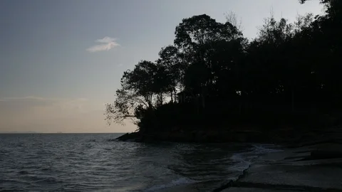 Sunset over ocean waves near Tropical coast. Stock Footage 87333634