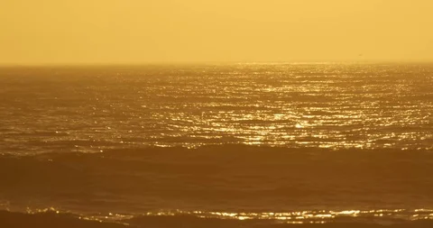 Sunset over ocean waves shot on red Stock Footage 127120530