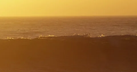 Sunset over ocean waves shot on red Stock Footage 127120788