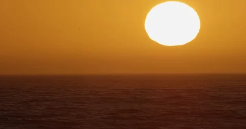 Sunset over ocean waves shot on red Stock Footage 127121237
