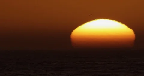 Sunset over ocean waves shot on red Stock Footage 127121469