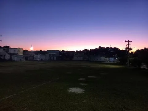 Sunset over open field Stock Photos