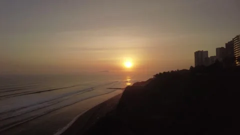 Sunset over Pacific ocean and coastal cliffs Lima Peru Video stock 348697299