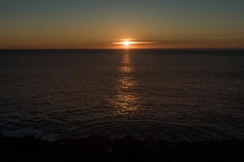Sunset over the Pacific Ocean on the coast of Oregon, USA. Stock Photos