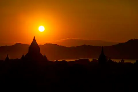 Sunset over pagodas Stock Photos