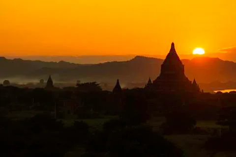 Sunset over pagodas Stock Photos