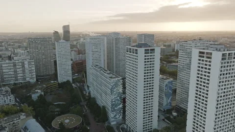 Sunset Over Paris: Aerial view with majestic skyscrapers bathed in the warm glow Stock Footage 250674550