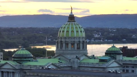 Sunset over Pennsylvania state capitol in Harrisburg, PA. Aerial parallax Stock-Footage 255009342