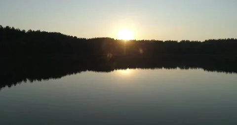 Sunset over pine forest and river. Aerial view Stock Footage 221680826