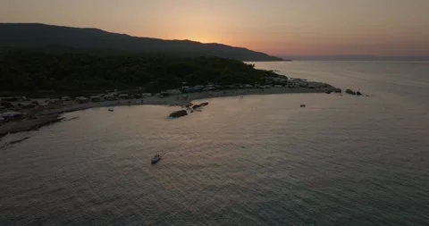 A Sunset Over Platanitsi Wild Beach With A Lonely Boat - Greece Aerial View 库存影片 250101824