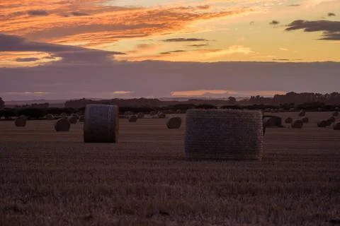 Sunset over ploughed fields Stock Photos