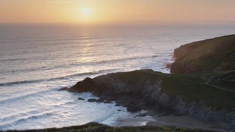 Sunset over Polurrian Cove, Cornwall, England. Stock Footage 128204670