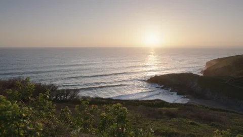 Sunset over Polurrian Cove, Cornwall, England. Stock Footage 128211676