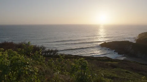 Sunset over Polurrian Cove, Cornwall, England. Stock Footage 128216603
