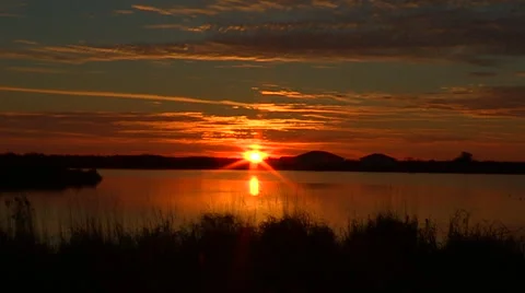 Sunset over a Pond Stock Footage 47986311