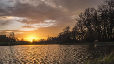 Sunset over pond with trees in Olomouc, Timelapse 4k Stock Footage 132504851