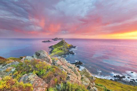 Sunset over popular tourist destination Torra di a Parata with Genoese Tower  Stock Photos