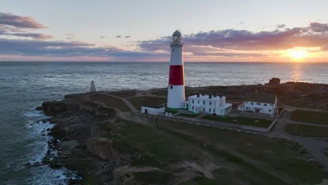 Sunset over Portland Bill Lighthouse, Portland, Isle of Portland, Dorset, UK Video stock 304458471