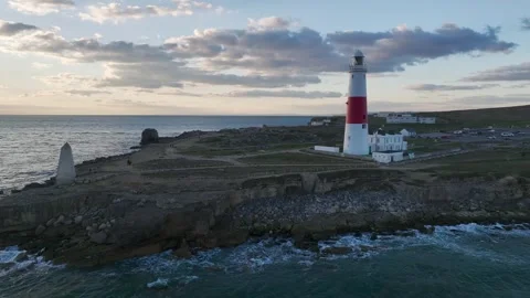 Sunset over Portland Bill Lighthouse, Portland Bill, Isle of Portland, Dorset Stock Footage 304818845