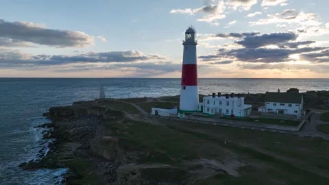 Sunset over Portland Bill Lighthouse, Portland Bill, Isle of Portland, Dorset Stock Footage 304818893
