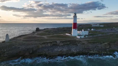 Sunset over Portland Bill Lighthouse, Portland Bill, Isle of Portland, Dorset Stock Footage 304818995