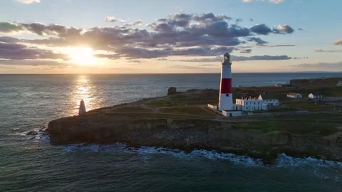 Sunset over Portland Bill Lighthouse, Portland Bill, Isle of Portland, Dorset Stock Footage 304819041
