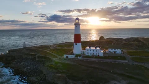 Sunset over Portland Bill Lighthouse, Portland Bill, Isle of Portland, Dorset Stock Footage 304819051