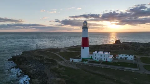 Sunset over Portland Bill Lighthouse, Portland Bill, Isle of Portland, Dorset Stock Footage 304819111