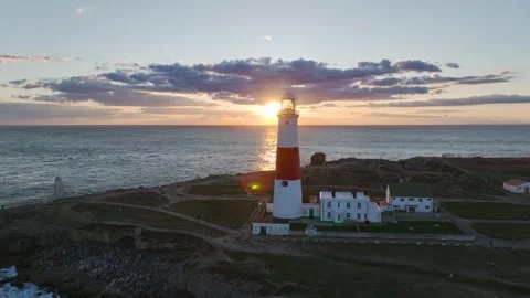 Sunset over Portland Bill Lighthouse, Portland Bill, Isle of Portland, Dorset Stock Footage 304819192