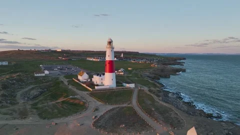 Sunset over Portland Bill Lighthouse, Portland Bill, Isle of Portland, Dorset Stock Footage 304819232