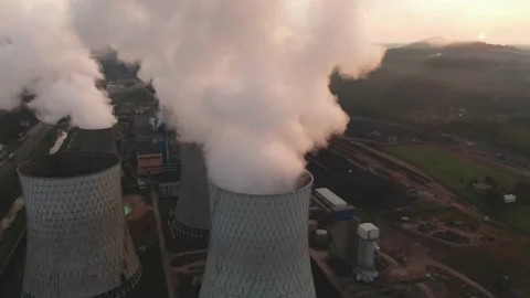 Sunset over a power plant Stock Footage 150192877