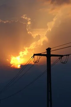 Sunset over powerlines Stock Photos