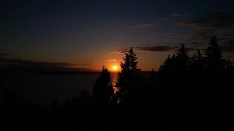 Sunset over Puget Sound Between trees in summer Stock-Footage 294705233
