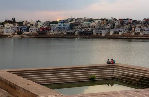 Sunset over Pushkar with scenic view to water reservoir Stock Photos