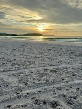 Sunset over a quiet beach Stock Photos