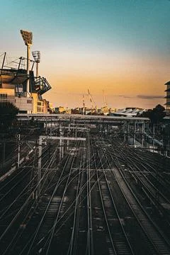 Sunset Over Railway Yard with Complex Track Network Stock Photos