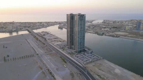 Sunset over Ras al Khaimah emirate landmark towers in the UAE aerial view at  Stock Footage 139335563