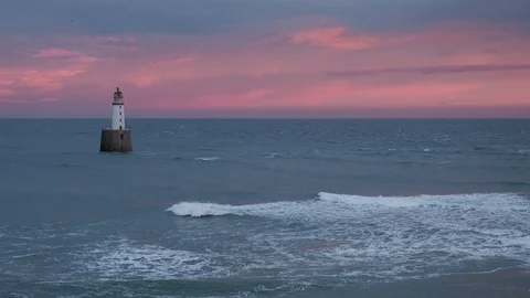 Sunset over Rattray Head Lighthouse, Scotland. Video stock 123088318