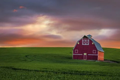 Sunset over a Red Barn Stock Photos