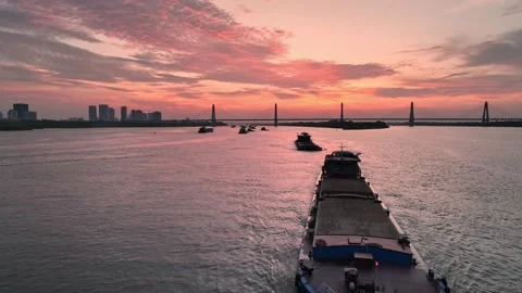 Sunset over the Red River with Nhat Tan Bridge and Hanoi skyline Stock Footage 344742887