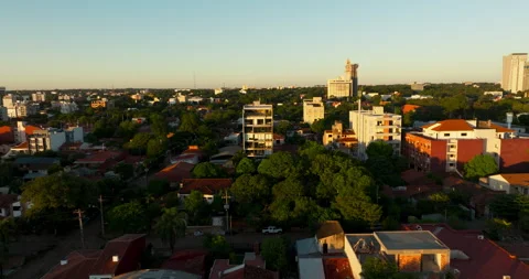 Sunset Over Residential District and City Skyline in Paraguay Видео 336306210