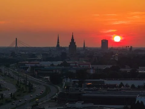 Sunset Over Riga Old Town with Vansu Bridge and Daugava River Stock Photos