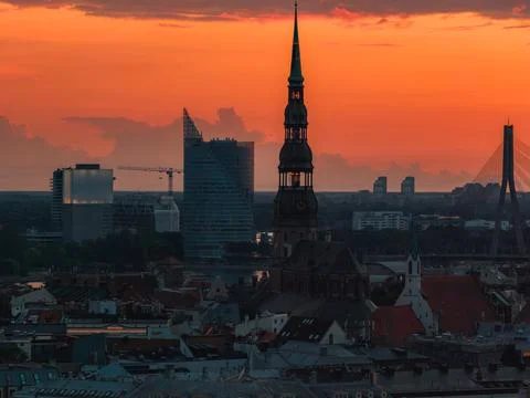 Sunset Over Riga with St. Peter's Church and Vansu Bridge Fotos Stock
